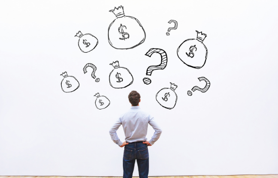 Man looking at a wall with money bags