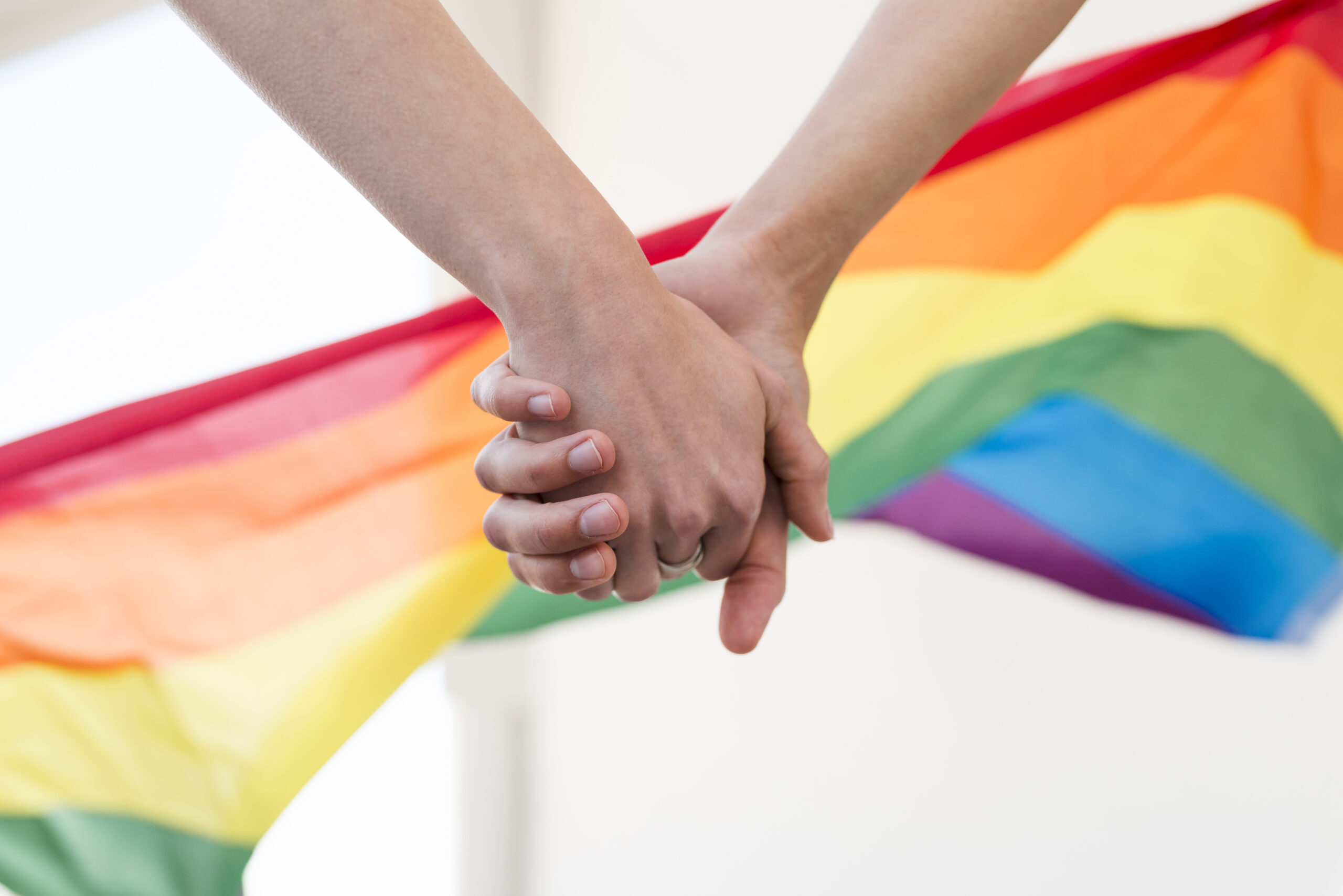 lgbt-couple-hands-join-together